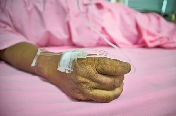 60344423 - woman patient in hospital bed
